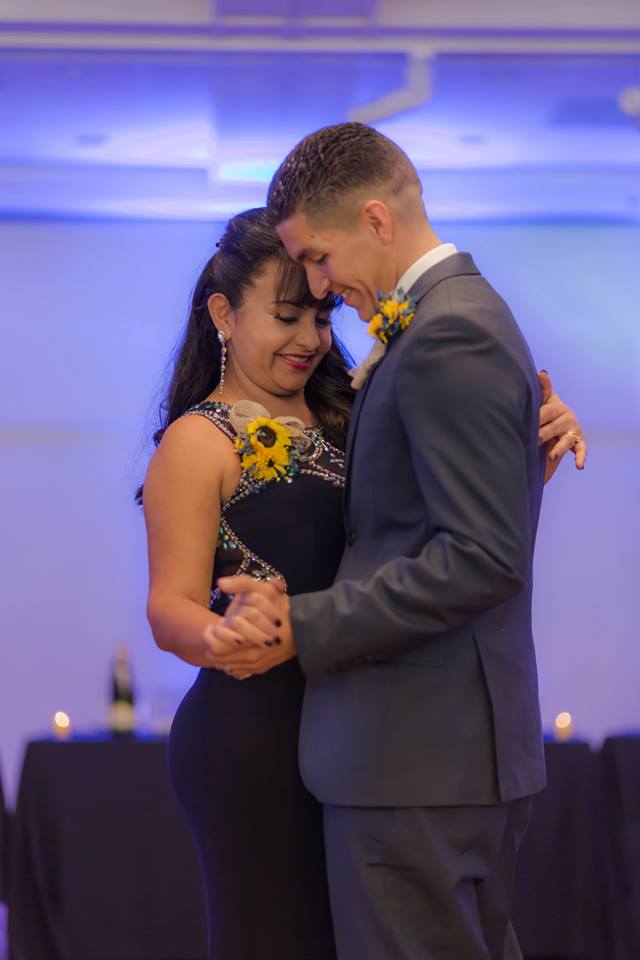 The mother of the groom and groom having their first dance during his Lakeside Terrace Wedding reception