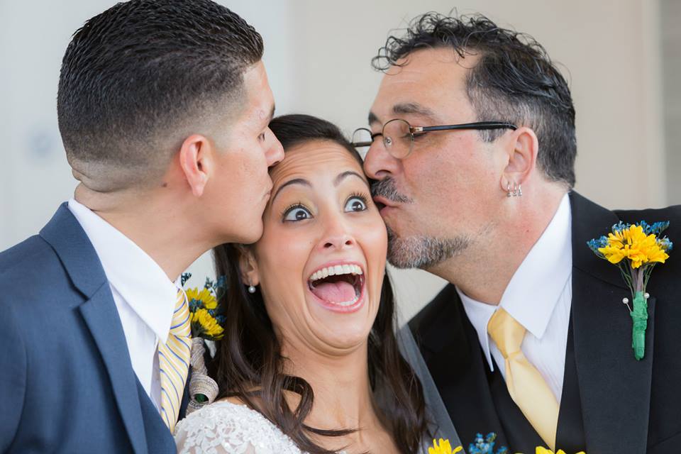 The groom and brides father kissing the bride at the Boca Raton Kingdom hall after their beautiful wedding ceremony before leaving to their lakeside Terrace Wedding reception