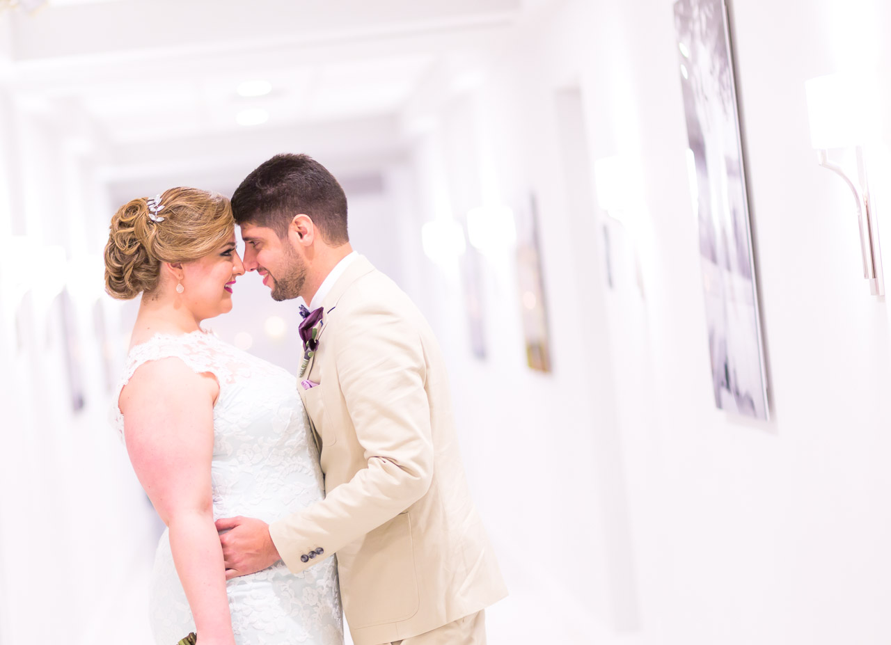 Couture Bridal Photography is a Fort Lauderdale Wedding Photographer that offers amazing wedding photography at the Bonaventure Country Club. Bride and groom in the hallway of Bonaventure Country Club for a bridal portrait.