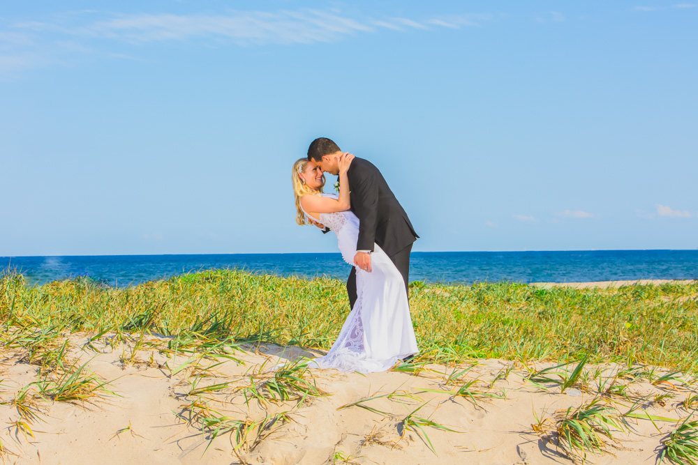 Couture Bridal Photography is the top rated and most trusted wedding photography studio for couples planning a wedding in Deerfield Beach. This Couple was posted on a sand dune on Deerfield Beach during their cocktail hour bridal portrait session during their wedding day at the Wyndham Deerfield Beach Resort. 